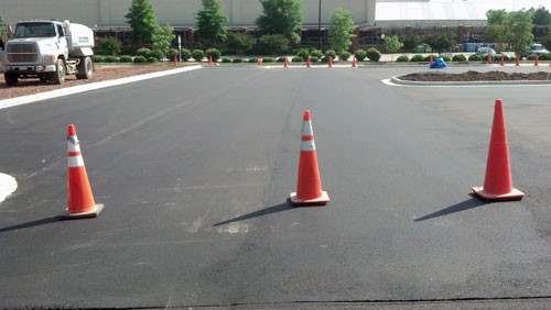 Paving: Asphalt is placed with an asphalt paver and rolled until density and smoothness are achieved.