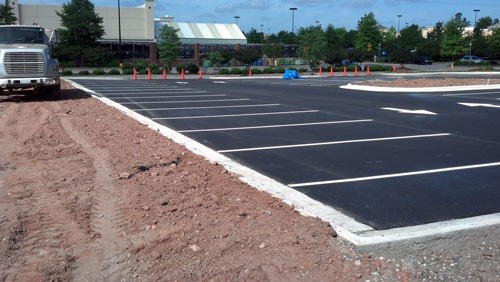 Striping: New line striping is installed after asphalt has cooled including ADA striping, directional arrows, and parking spaces.